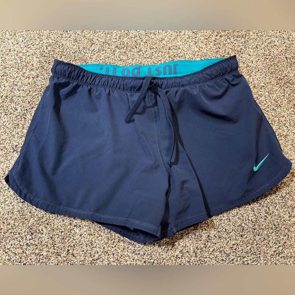 Nike Dri-FIT running shorts in navy blue with a teal waistband and trim large